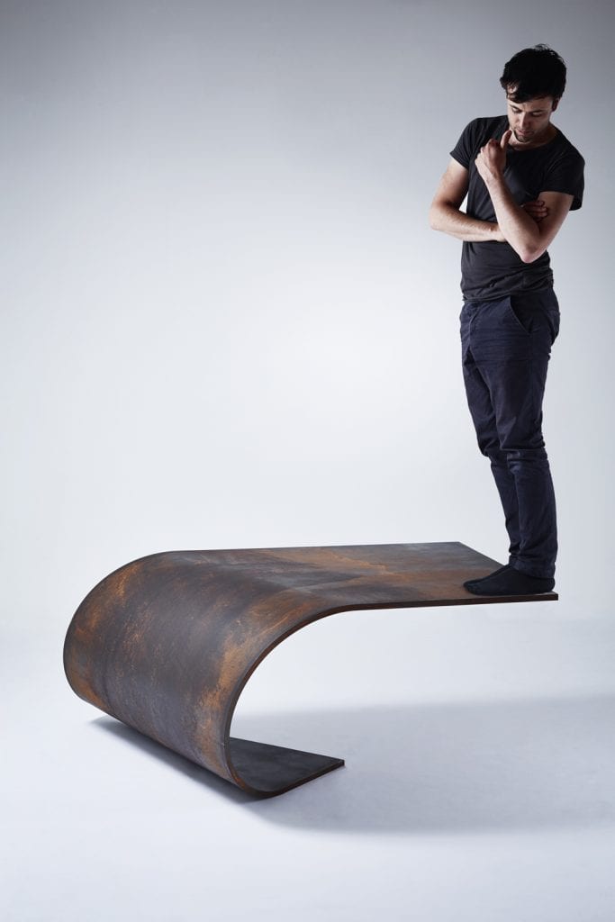 A Balanced Sheet of Steel: The Poised Table