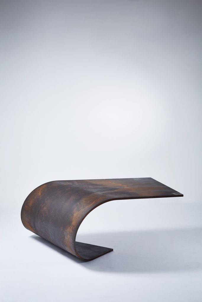 A Balanced Sheet of Steel: The Poised Table