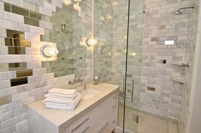 modern bathroom with mirror and marble tiles