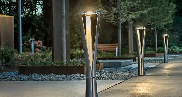 Four chrome outdoor illumination fixtures