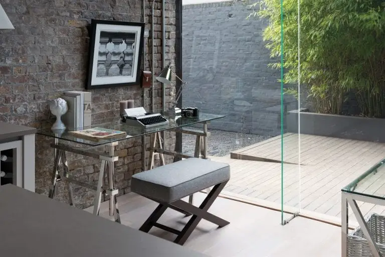 glass desk with bench near sliding door