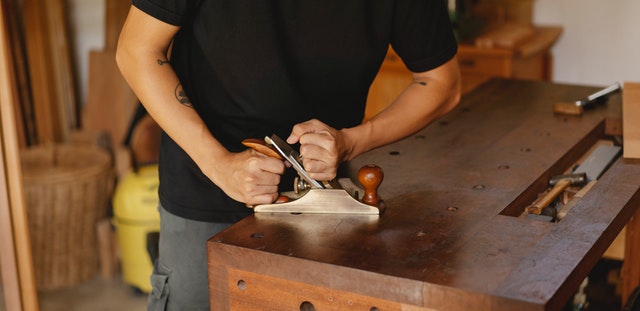 A carpenter working on a table